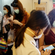 People wear masks as they commute to work, after PM2.5 levels became hazardous in Bangkok on Jan. 21.